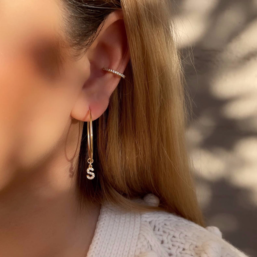 Model Wearing Eternity CZ Pave Ear Cuff with Design Your Own Hoop Earrings -Slide On Style featuring Letter CZ Pave Charm (S) with Endless Hoop Earrings (30mm)