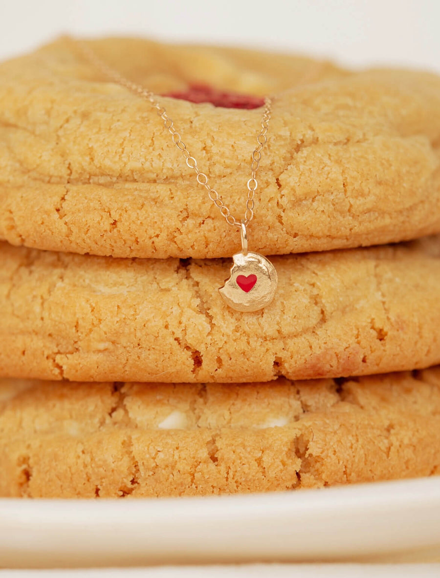 Single-White-Chocolate-Raspberry-Ale-Weston-x-Milk-Jar-Cookies-Gold-Enamel-Necklace-layered-over-cookie